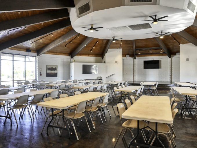 View of the clubhouse with tables and chairs