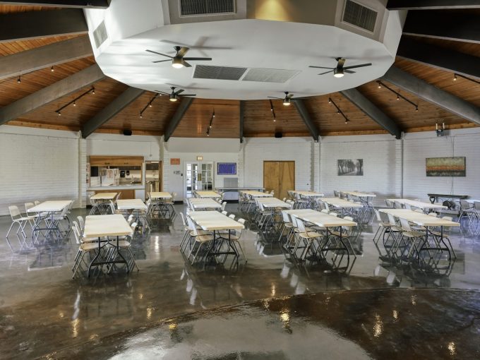 View of the clubhouse with tables and chairs